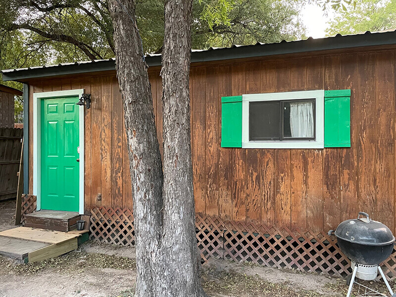 Gilly at Capri located on River Road, New Braunfels, TX for a rental house, cabins and float-up bar and grill.